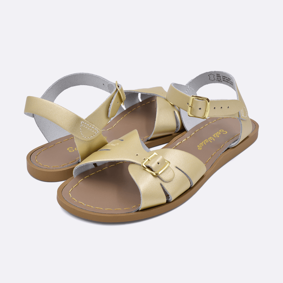 Two 900 Classic style sandal color gold. Both pushed together facing the camera diagonally.	Adult Size.